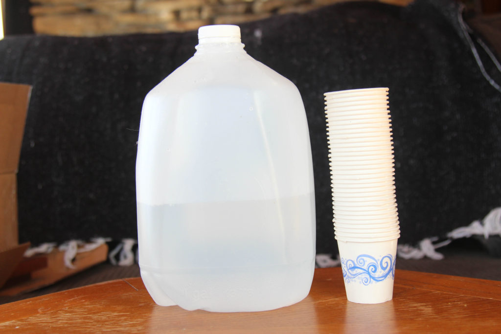 Water and paper cups to dispense medicines